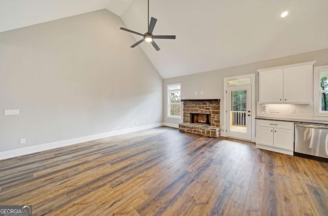 107 Bob White Dr, Calhoun, GA 30701 - unfurnished living room with high vaulted ceiling, a ceiling fan, dark wood-style flooring, a fireplace, and recessed lighting