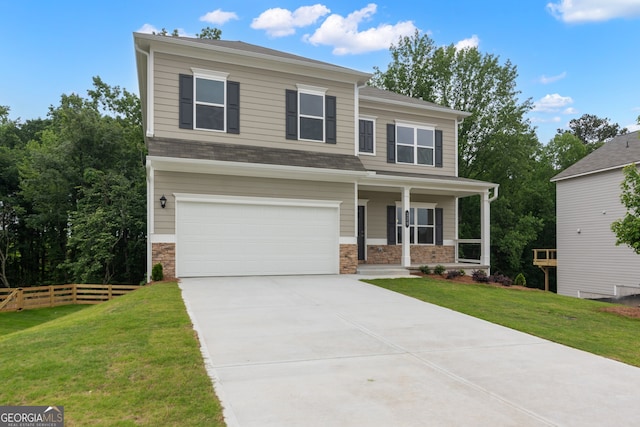 141 Roxeywood Way, Winder, GA 30680 - view of front of home with an attached garage, covered porch, concrete driveway, and stone siding