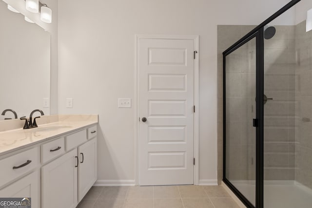 141 Roxeywood Way, Winder, GA 30680 - full bath with vanity, tile patterned flooring, a shower stall, and baseboards