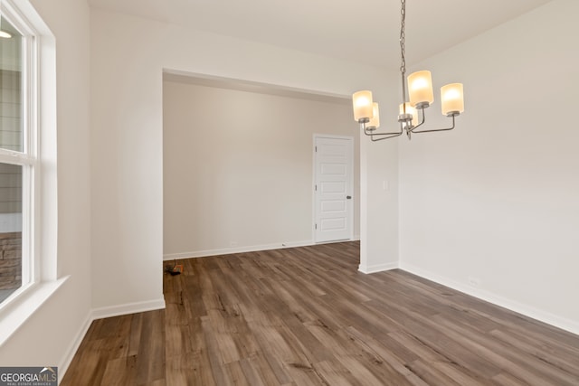 141 Roxeywood Way, Winder, GA 30680 - spare room featuring a chandelier, wood finished floors, and baseboards