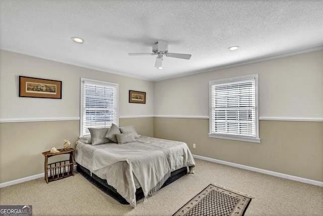 bedroom with a textured ceiling, carpet floors, recessed lighting, and baseboards