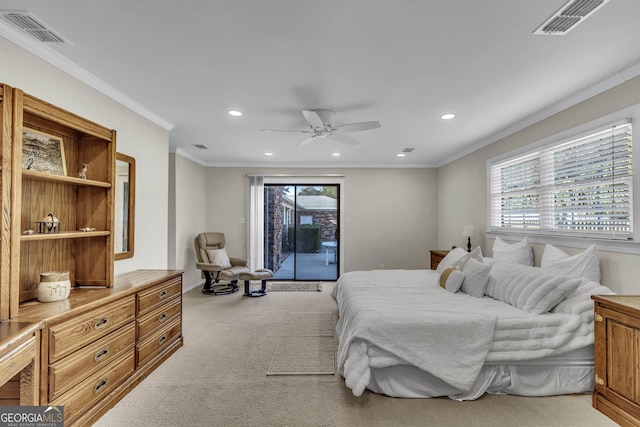 bedroom with crown molding, multiple windows, visible vents, and access to exterior