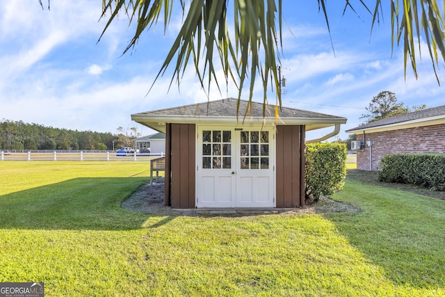 view of shed with fence