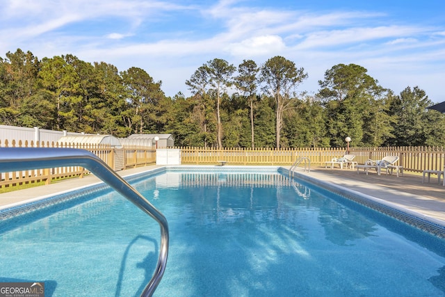 view of pool with fence and a fenced in pool