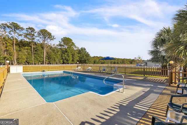 view of pool with fence, a fenced in pool, and a patio