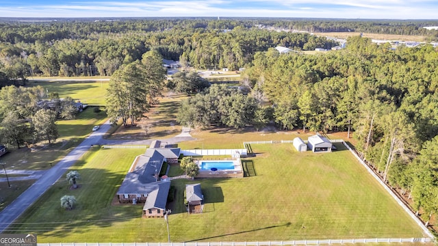 drone / aerial view featuring a view of trees