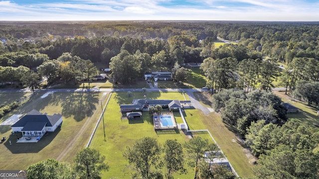 bird's eye view featuring a forest view