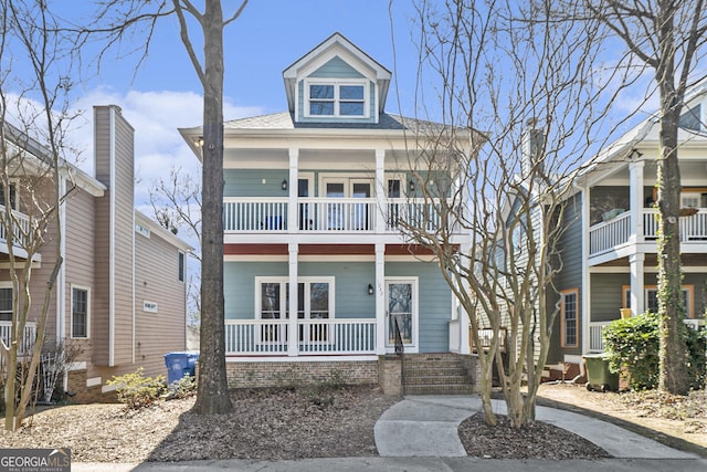 view of front of home featuring a porch and a balcony