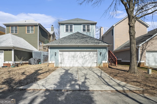 view of front of property featuring driveway, a garage, and roof with shingles