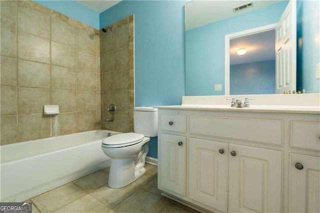 full bathroom with visible vents, toilet, tile patterned flooring, vanity, and shower / bathing tub combination