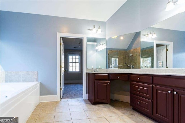 full bath with double vanity, tile patterned floors, vaulted ceiling, a bath, and walk in shower