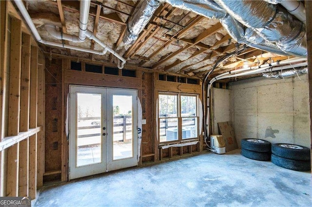 misc room featuring a garage and french doors