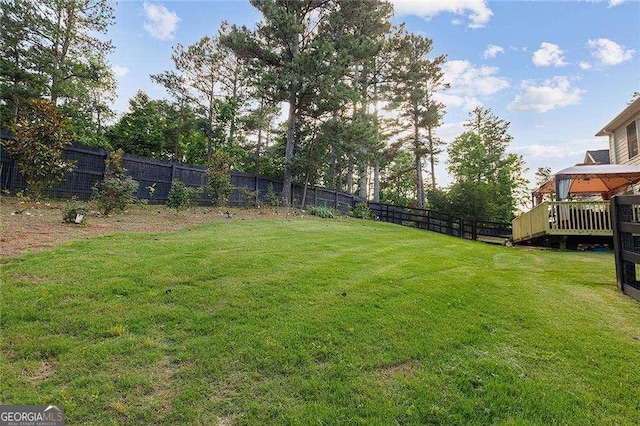 view of yard featuring a fenced backyard and a gazebo