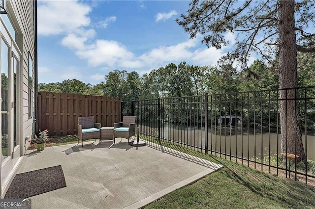 view of patio featuring fence