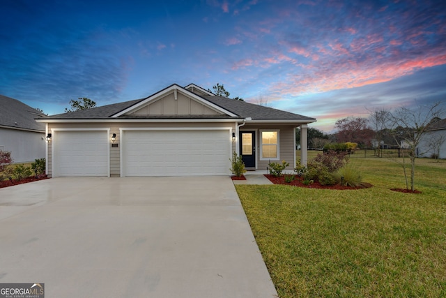 view of front of property featuring board and batten siding, concrete driveway, a front lawn, and a garage