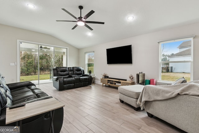 living area with light wood-type flooring, recessed lighting, a ceiling fan, and lofted ceiling