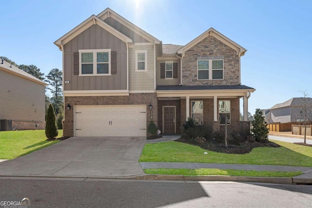 craftsman inspired home featuring brick siding, an attached garage, board and batten siding, a front yard, and driveway