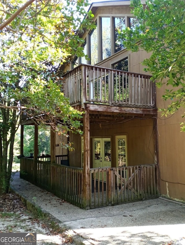 back of property featuring a wooden deck