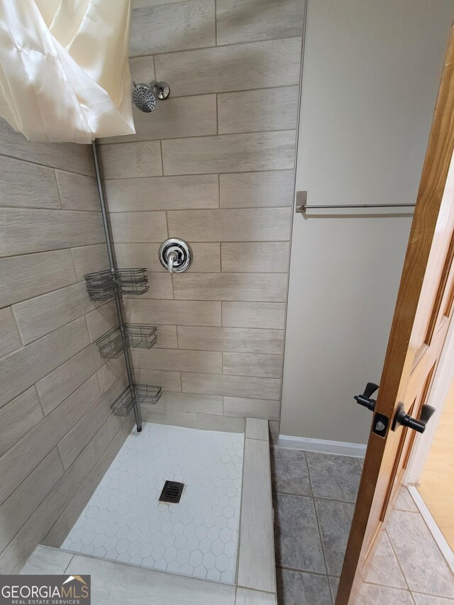 bathroom featuring tile patterned flooring, baseboards, visible vents, and toilet