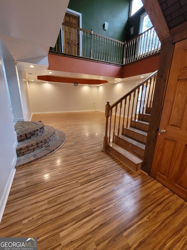 unfurnished room featuring wood finished floors, visible vents, and recessed lighting