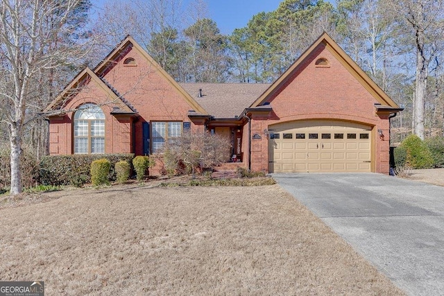 view of front of home with a garage, concrete driveway, and brick siding