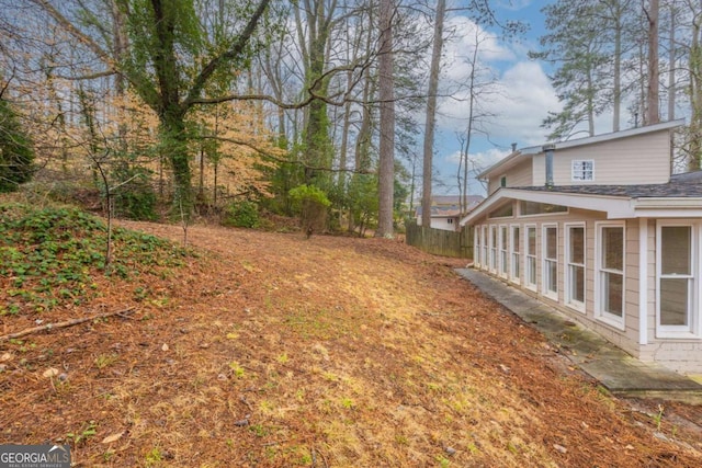 view of yard with a sunroom