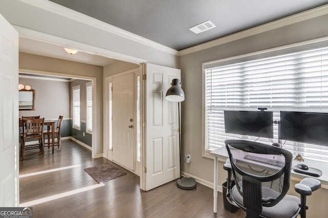 office area featuring baseboards, crown molding, visible vents, and wood finished floors