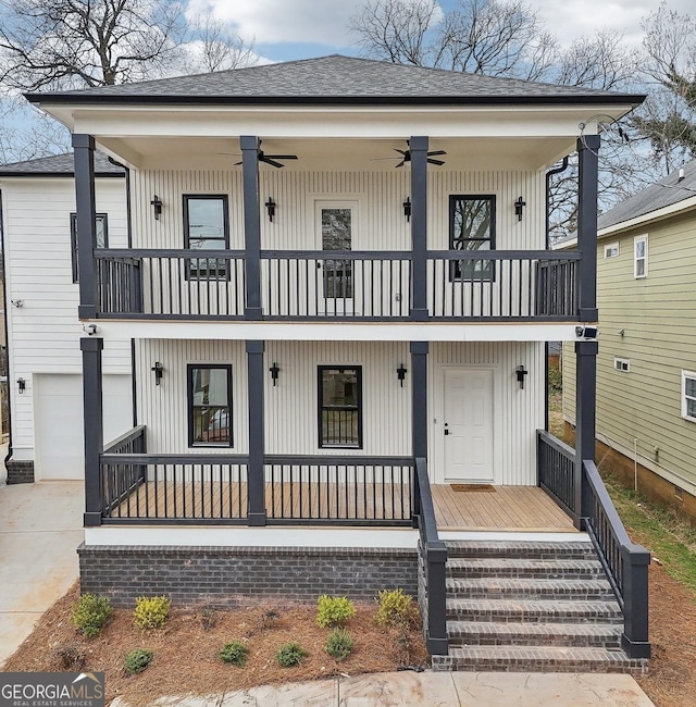 view of front of property with a balcony, a ceiling fan, driveway, a porch, and a shingled roof