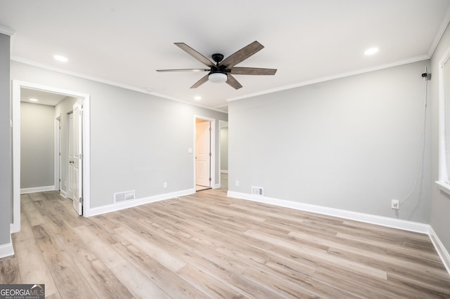 unfurnished room with light wood-type flooring, baseboards, visible vents, and a ceiling fan