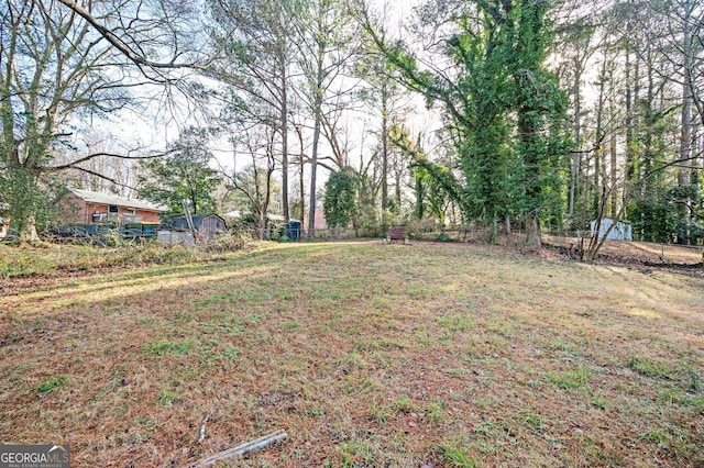 view of yard featuring fence