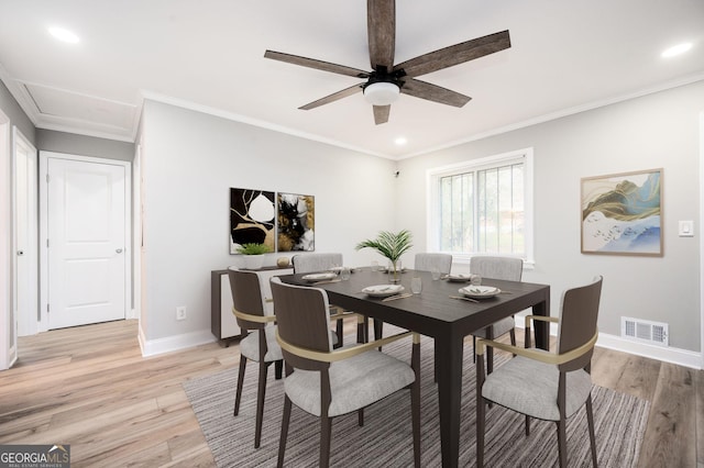 dining space with recessed lighting, visible vents, light wood-style flooring, ornamental molding, and baseboards