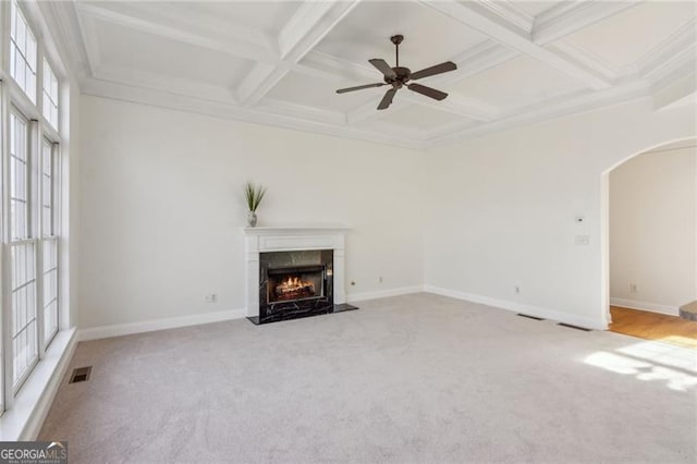 3690 Millwater Xing, Dacula, GA 30019 - unfurnished living room with arched walkways, carpet floors, a fireplace, beamed ceiling, and coffered ceiling