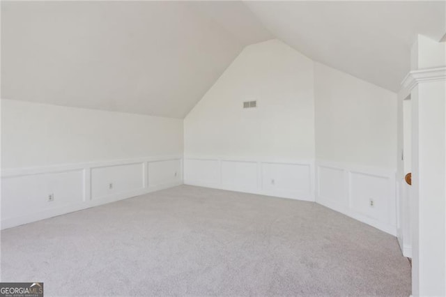 3690 Millwater Xing, Dacula, GA 30019 - bonus room featuring light colored carpet, a decorative wall, lofted ceiling, and a wainscoted wall