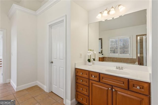 3690 Millwater Xing, Dacula, GA 30019 - full bath featuring vanity, tile patterned floors, a shower with shower door, and crown molding