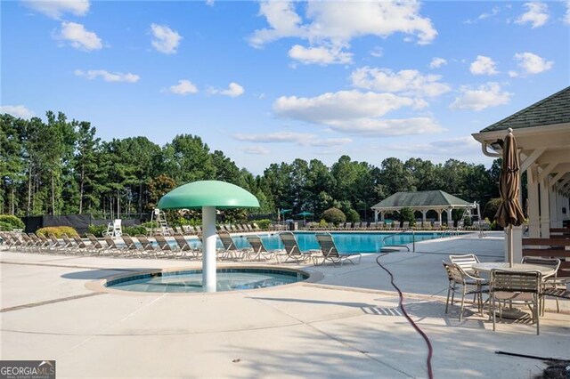 3690 Millwater Xing, Dacula, GA 30019 - community pool with a patio area, a gazebo, and a water play area