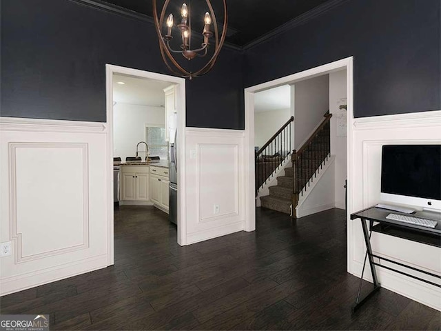 dining area with dark wood finished floors, wainscoting, stairway, ornamental molding, and a notable chandelier