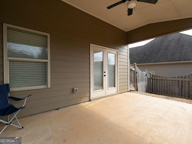 view of patio with ceiling fan, french doors, and fence