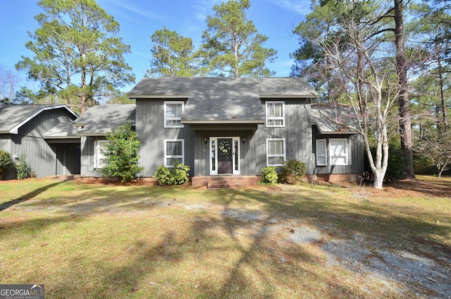 view of front of house featuring board and batten siding and a front lawn