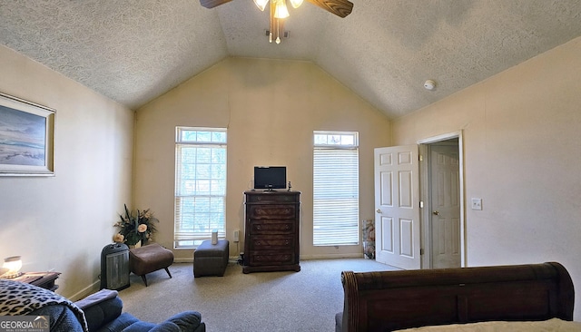 bedroom featuring light colored carpet, vaulted ceiling, a textured ceiling, and ceiling fan