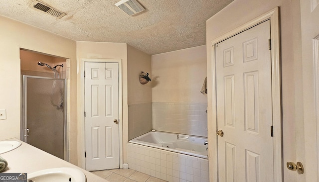 bathroom with a tub with jets, tile patterned flooring, a shower stall, and visible vents