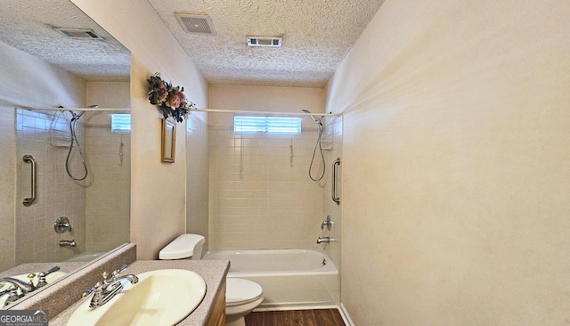 full bathroom with toilet, wood finished floors, vanity, visible vents, and tub / shower combination