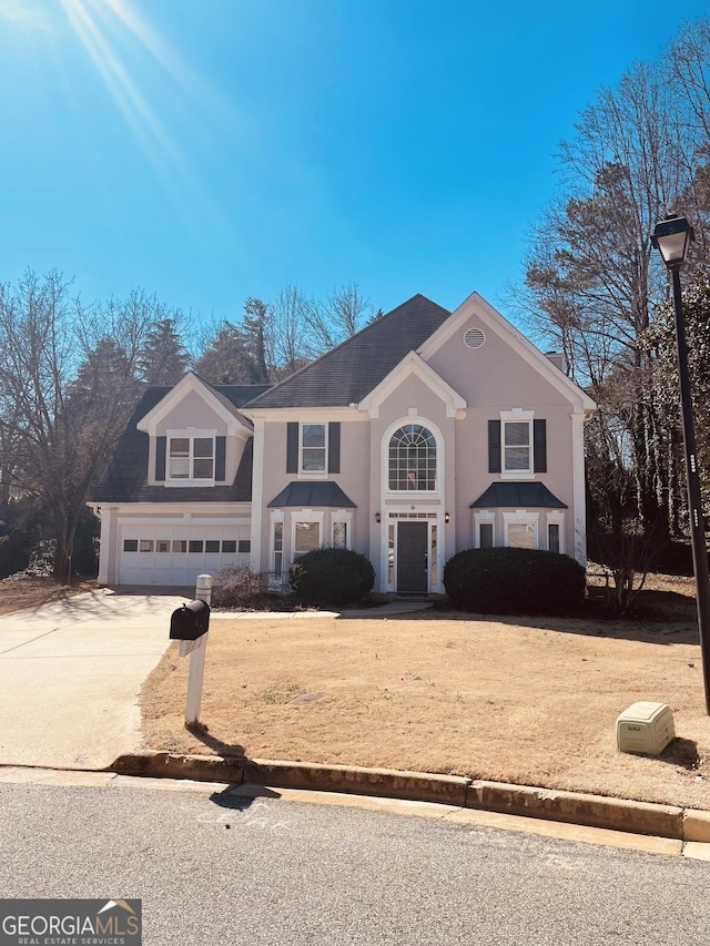 view of front of house with driveway and a garage