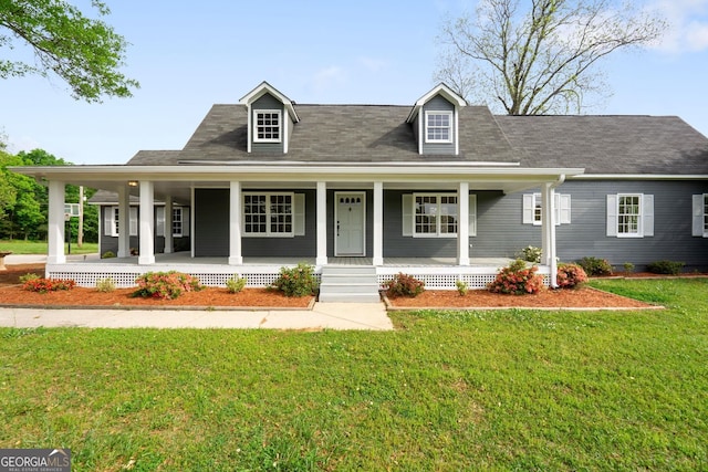 view of front of house with a front lawn and a porch