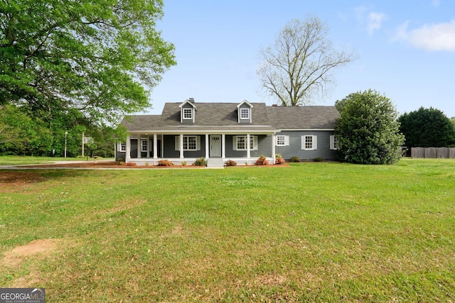 cape cod house featuring a porch and a front yard