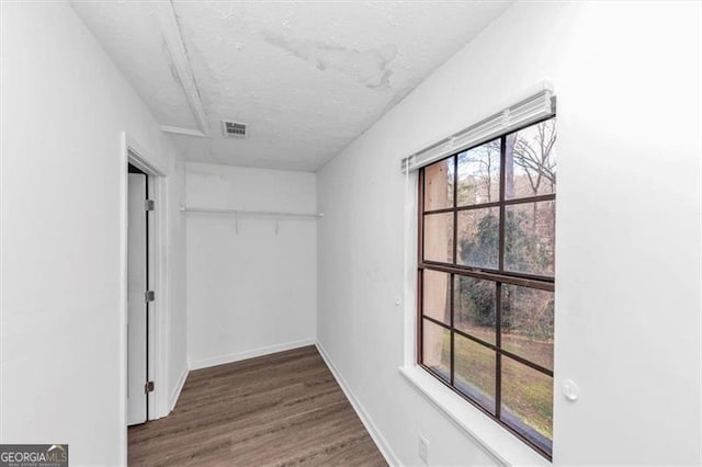 interior space featuring visible vents and wood finished floors