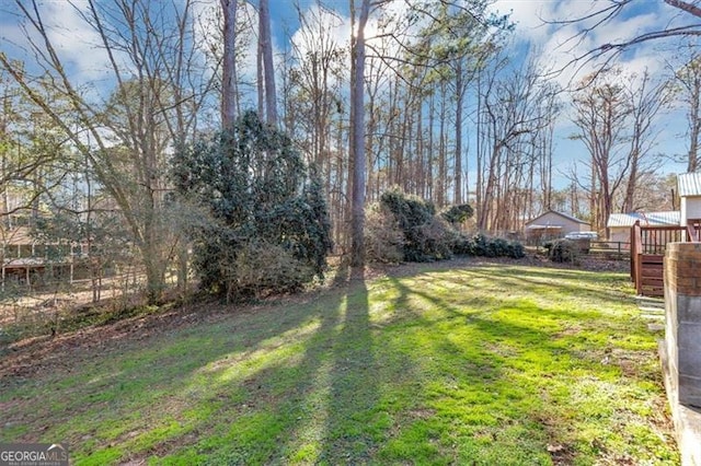 view of yard with a wooden deck