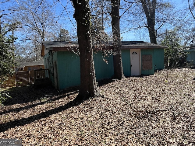 view of outdoor structure featuring fence