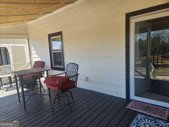 deck featuring outdoor dining area