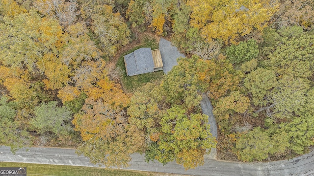 birds eye view of property with a forest view