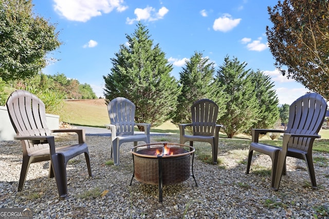 view of patio / terrace with a fire pit